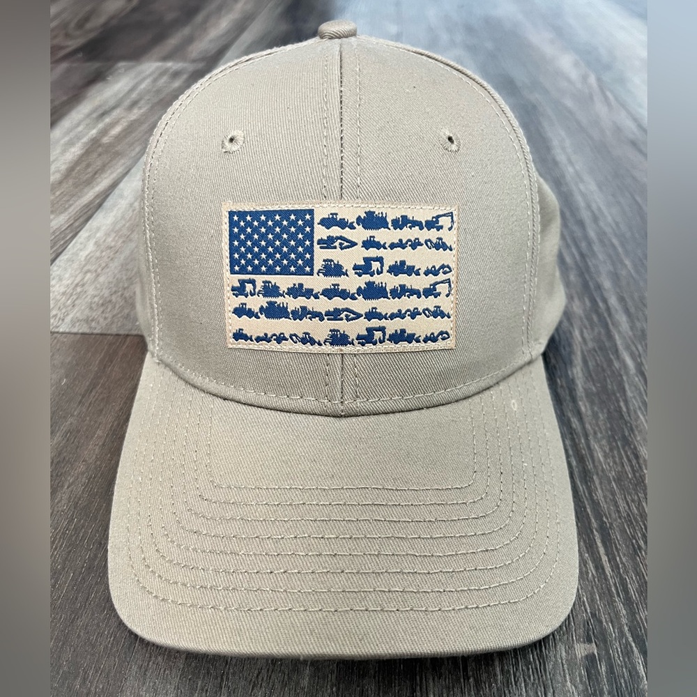 Caterpillar Tan Hat with Blue Flag Design